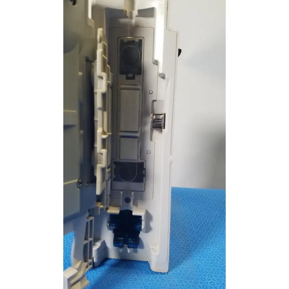 White plastic electrical outlet box with gray components and blue connectors for cardinal health alaris pump 8100 series