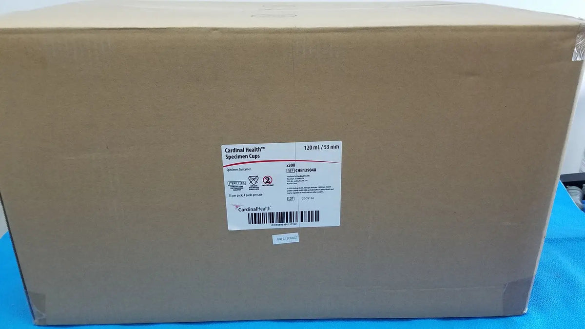 Brown cardboard box of cardinal health specimen cup chb13904a 120ml with white sticker showing product details and barcode