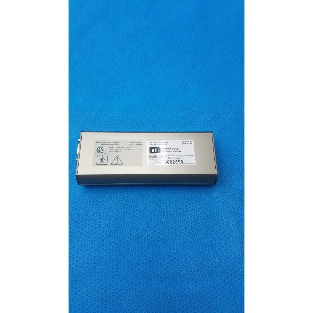 Silver rectangular caretone global medical innovative telemedicine sender with matte finish and printed labels on its surface