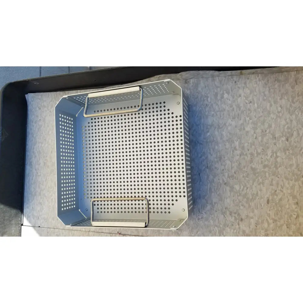 Silver perforated metal grill basket with two handles for case medical half size sterilization use