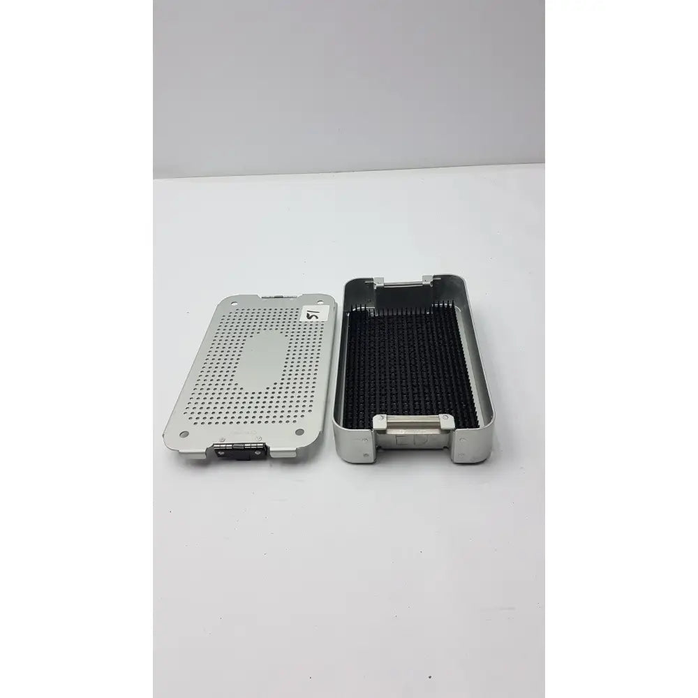 Silver metallic case medical mc02 solid brass sterilization container with perforated lid and black interior tray