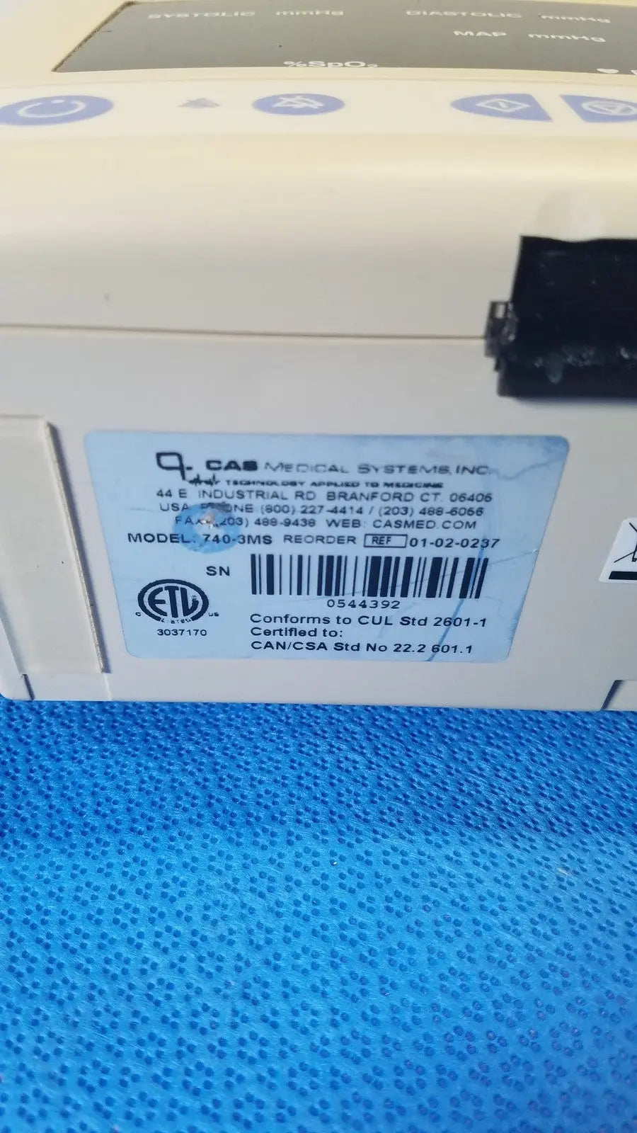 Beige casmed 740 masimo set spo2 blood pressure patient monitor with blue label showing model and serial number information