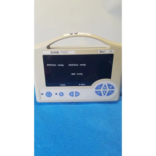 Beige casmed 740 masimo set spo2 blood pressure patient monitor with digital display and blue control buttons