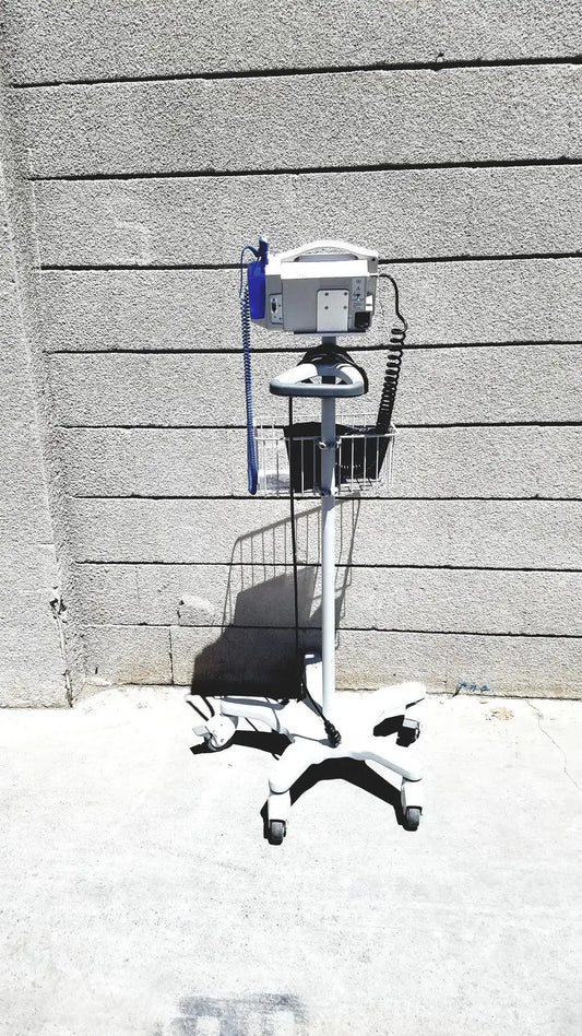 White medical iv infusion pump on wheeled metal basket cart in casmed 740 vital signs monitor rolling stand lot of 3