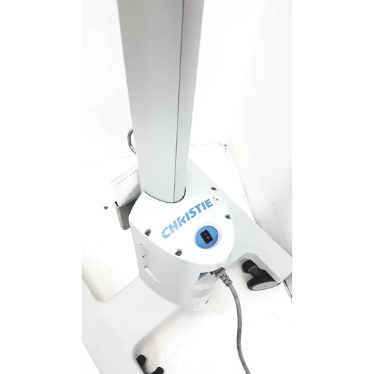 White Christie brand medical examination table base with blue power button and black foot pedal for Christie VeinViewer Vision vein visualization system