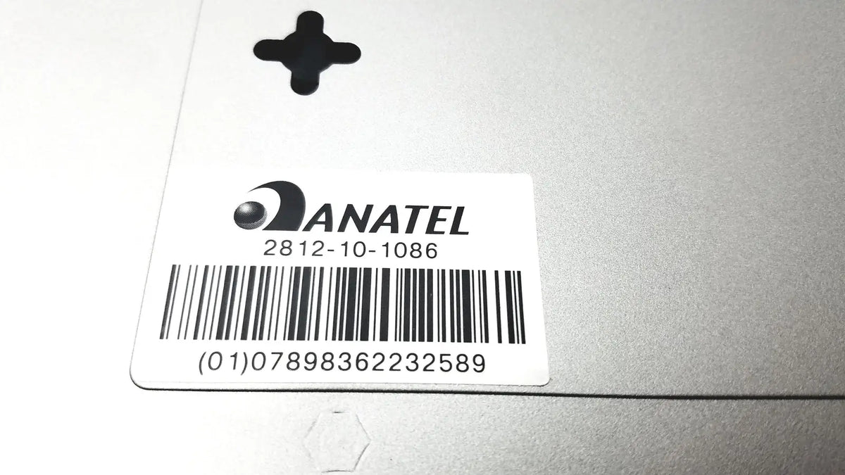 Silver anatel compliance label with black barcode and serial number on the back of cisco sf300-8 managed switch