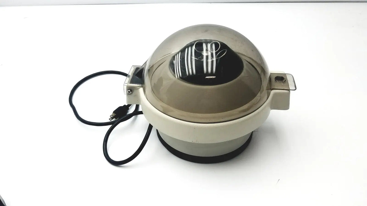 Beige and clear plastic dome-shaped clay adams roche model 0171 analytical centrifuge with black circular base