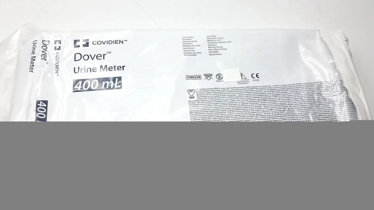White plastic package containing a covidien dover urine meter 400ml for accurate fluid measurement in medical settings