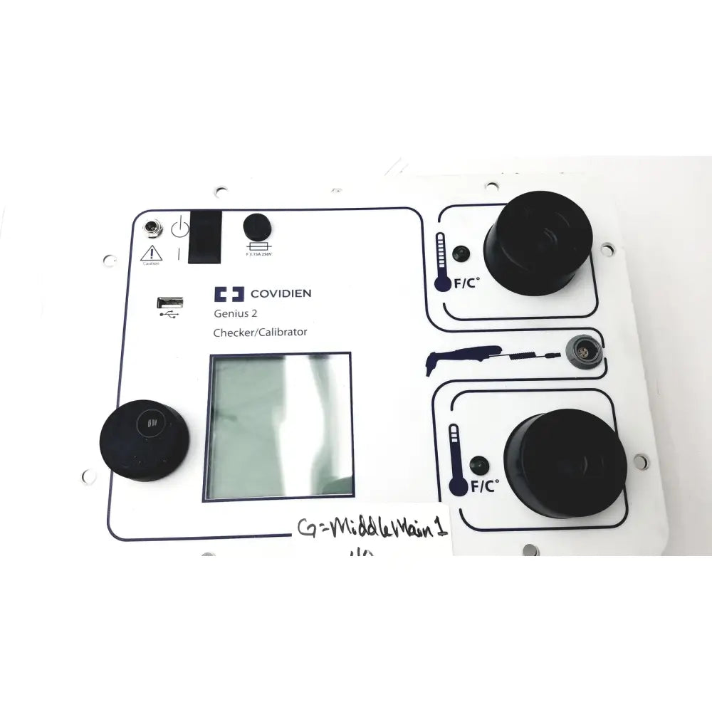 White covidien genius 2 checker calibrator with black knobs, central screen, and temperature indicators for test meters