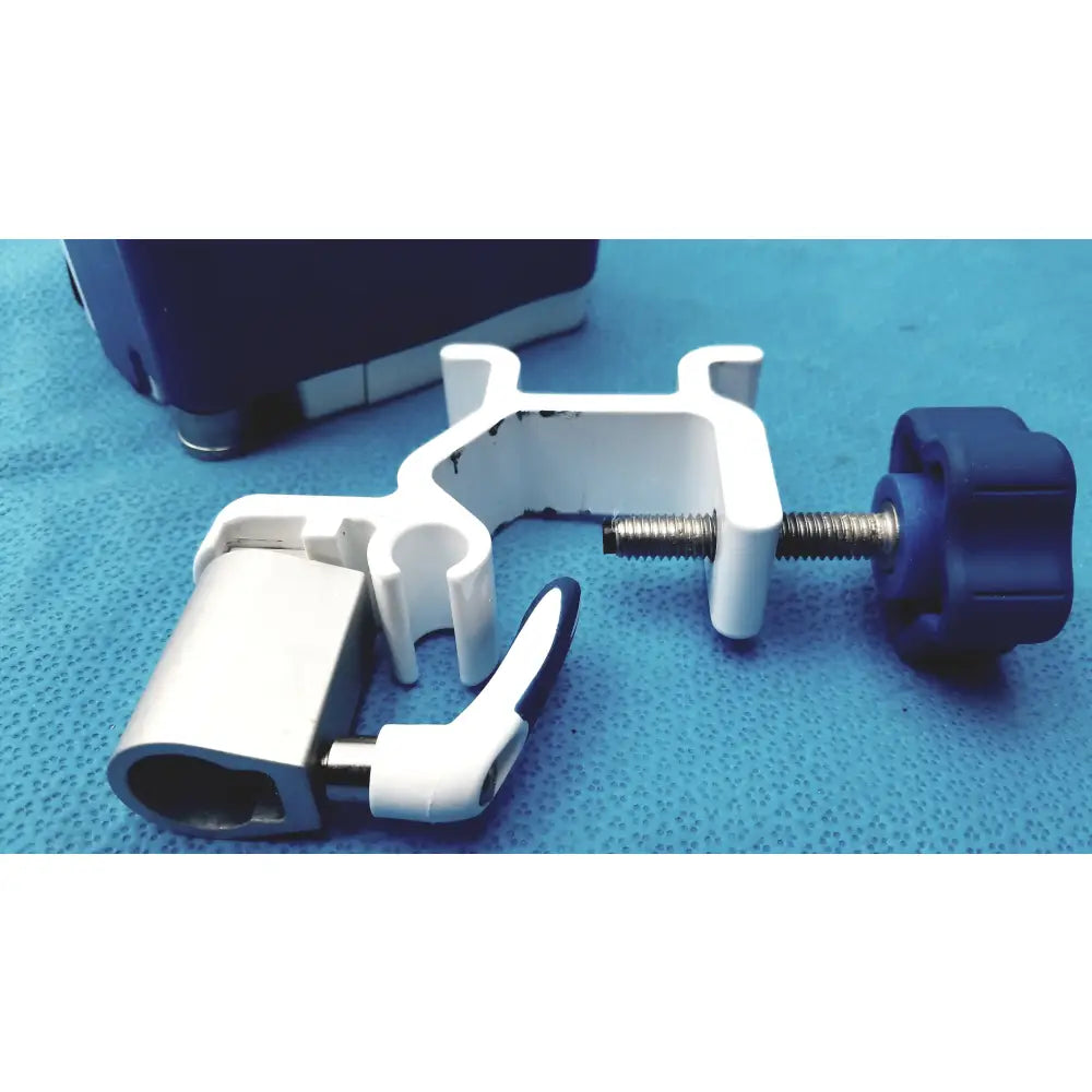 White plastic pole clamp with blue knob and silver screw for secure attachment on Covidien kangaroo joey flush pump