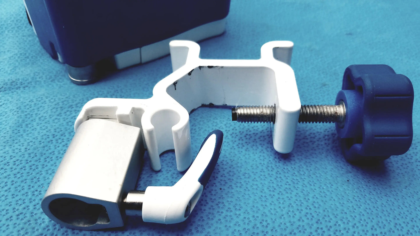 White plastic pole clamp with blue knob and silver screw for secure attachment on Covidien kangaroo joey flush pump