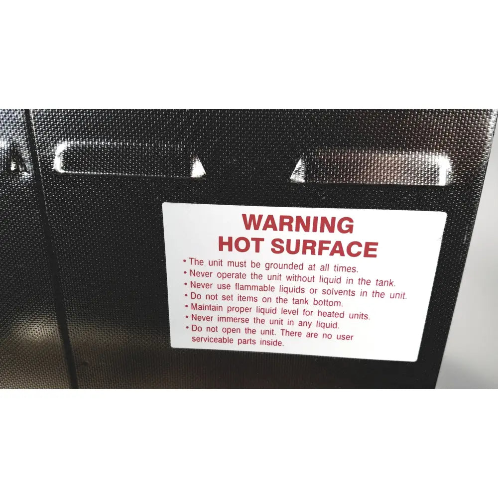Black textured surface with white warning label and red text warning hot surface on crest ultrasonic powersonic cleaner model p1100d