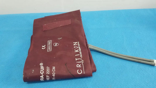 Maroon Critikon DURA-CUF large adult blood pressure cuff with gray tubing for adult blood pressure monitoring