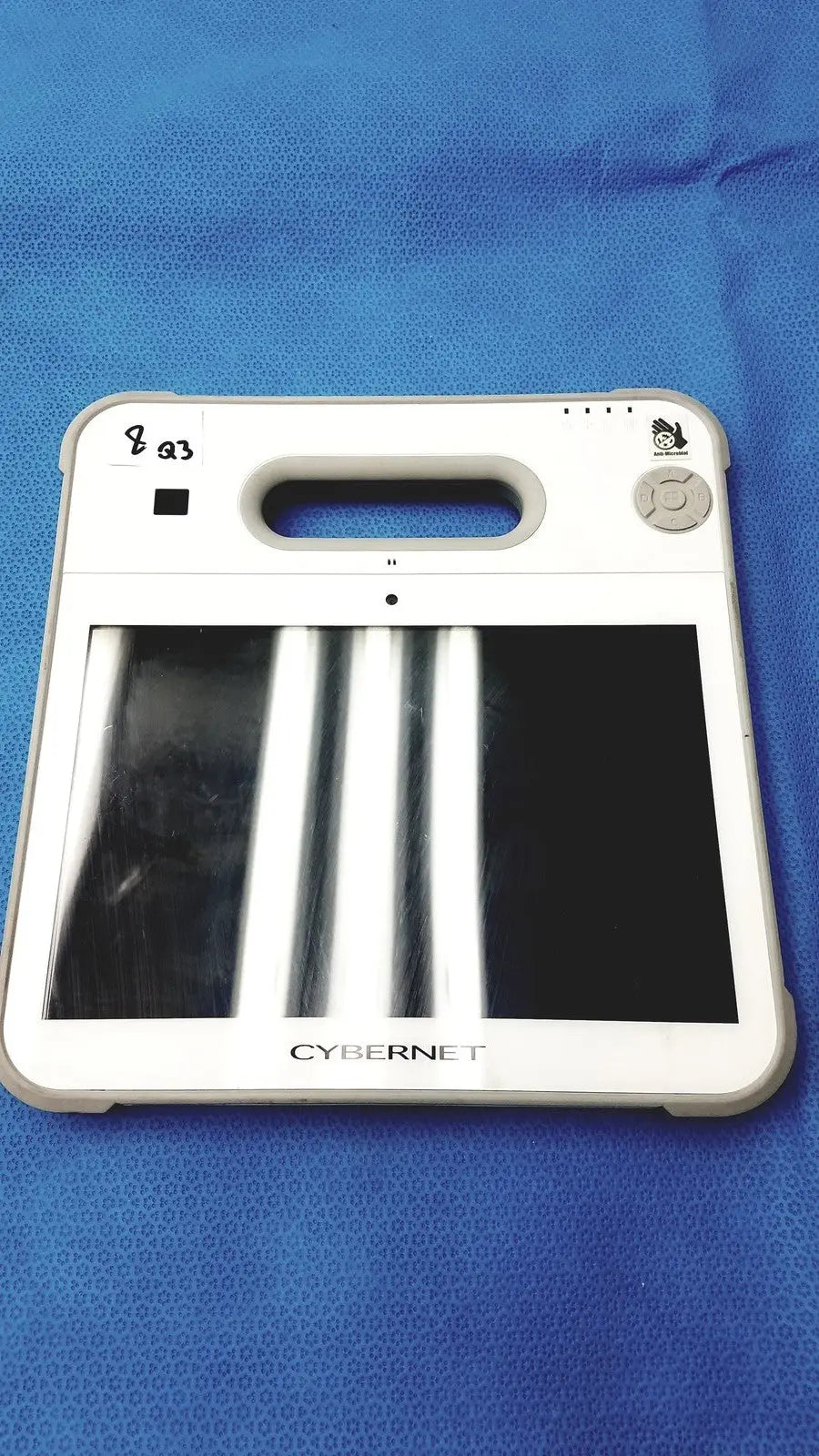 White cybernet medrx-2893 scanning tablet computer handheld x-ray machine with rectangular screen displaying white stripes