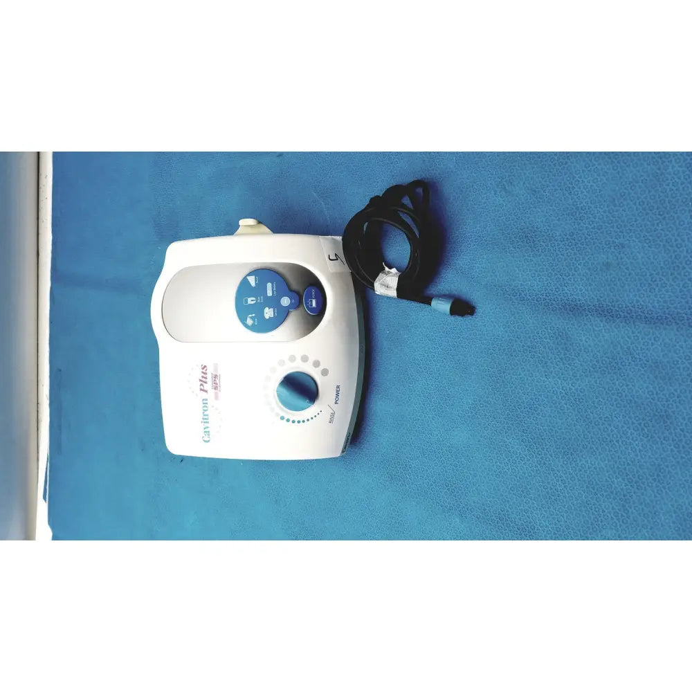 White dentsply cavitron plus ultrasonic scaling unit with blue control panel and coiled black cord for dental use