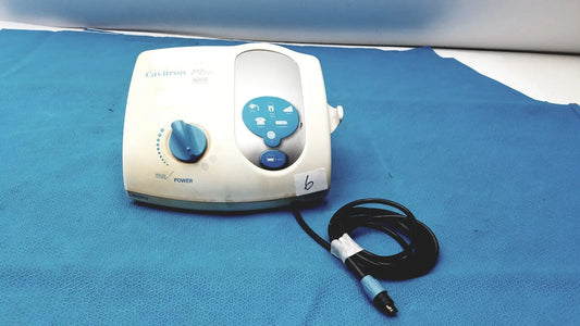 White and blue dentsply cavitron plus ultrasonic scaling unit type gen-131 with coiled black cable visible from the back side