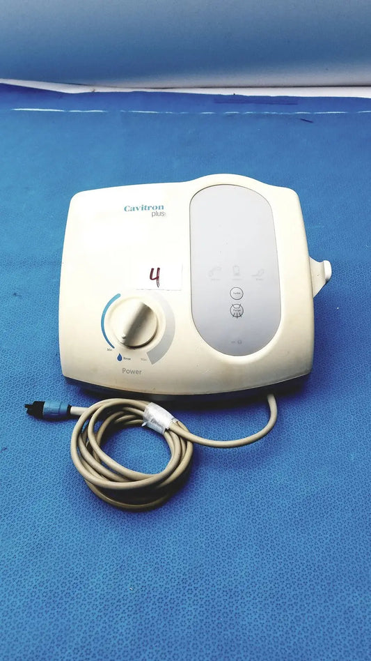 Cream-colored dentsply cavitron plus ultrasonic scaling unit with coiled beige power cord and control dial type GEN-136