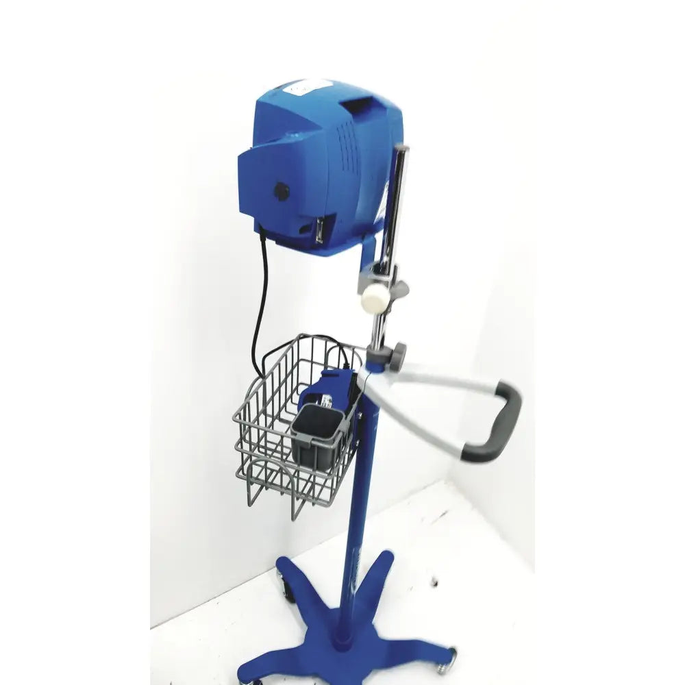 Blue industrial-grade mixing machine with metal basket and handle on wheeled stand for dinamap v100 vital signs monitors