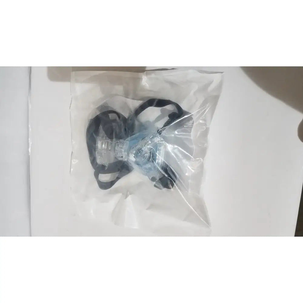 Clear plastic face mask with black elastic straps shown alongside drive rtl12027ra raised toilet seat with removable arms