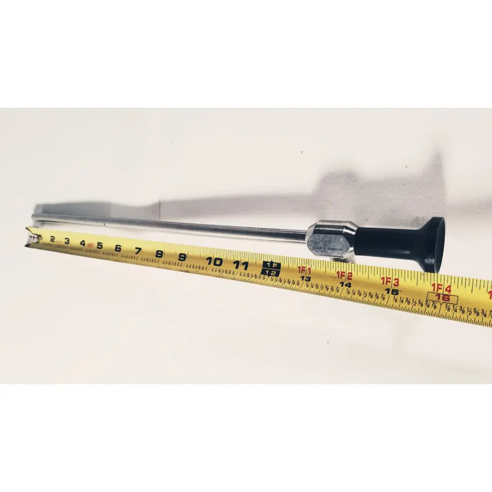 Silver medical dyonics autoclave degree 10mm laparoscope with black ergonomic handle and metallic joints shown with measuring tape