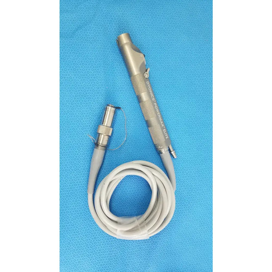 Silver metallic dyonics powermax elite shaver handpiece with textured grip and coiled gray cable for medical equipment use