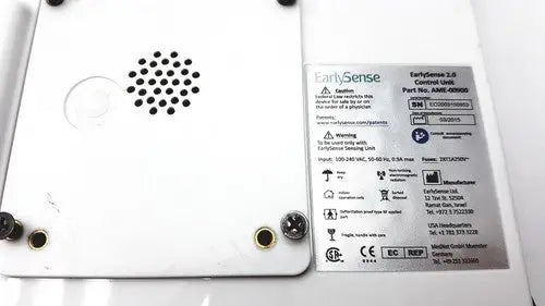 White plastic earlysence 2.0 control unit with black speaker grille and gold screw holes for reuse medical applications