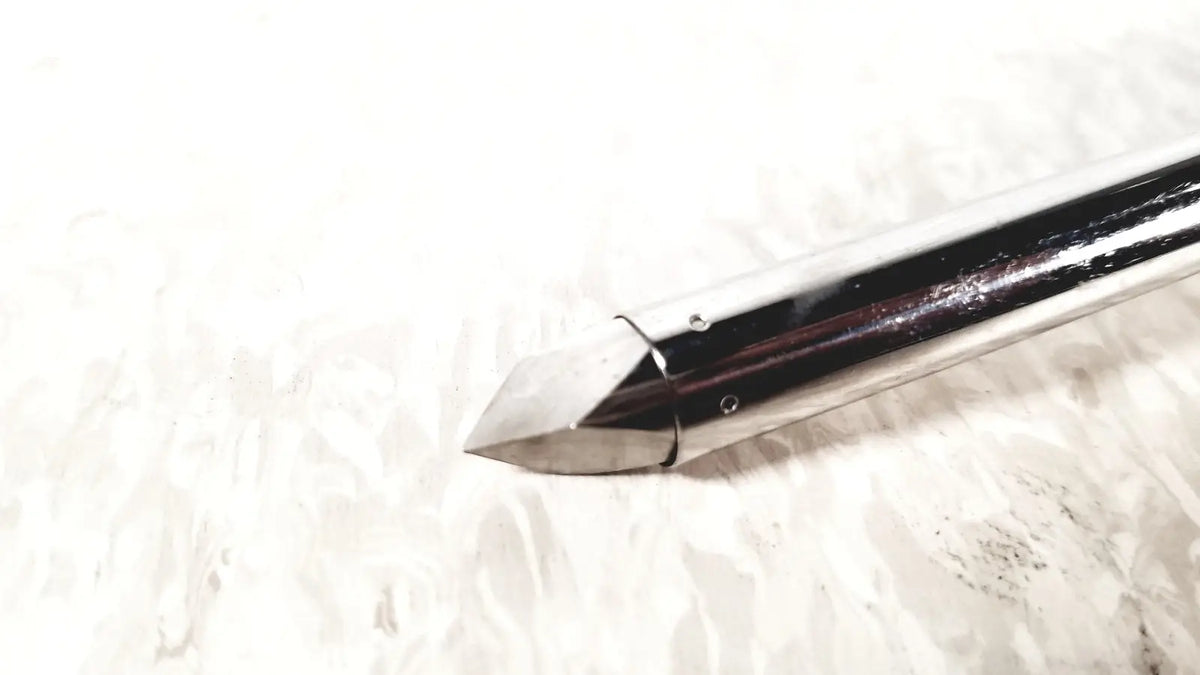Shiny metallic arrowhead with pointed tip and reflective surface from eder instrument cat 1110 c3 for gsh endoscope
