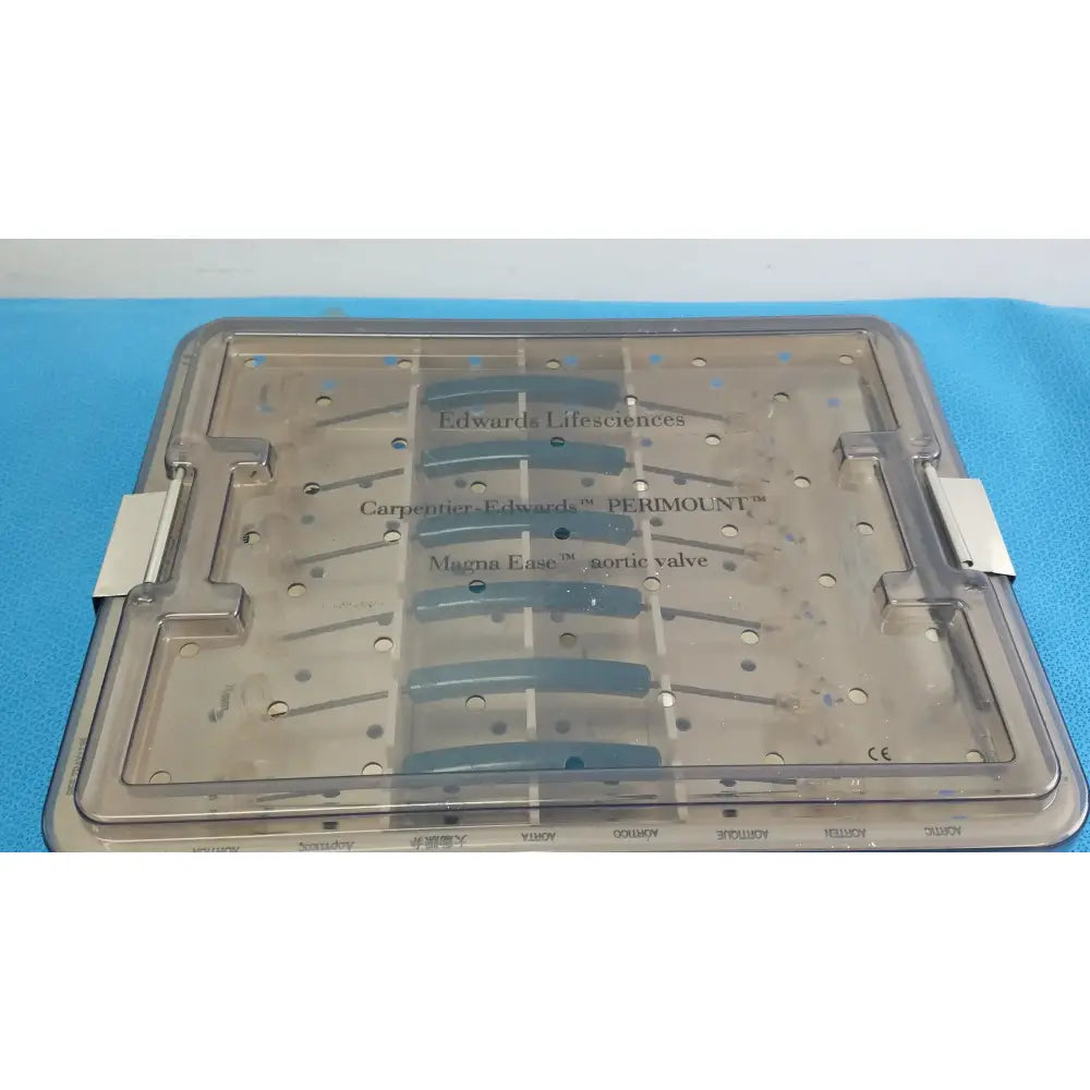 Clear plastic surgical tray with labeled compartments holding blue valve components from edwards life science 1111 aortic valve sizer set for buy used medical equipment