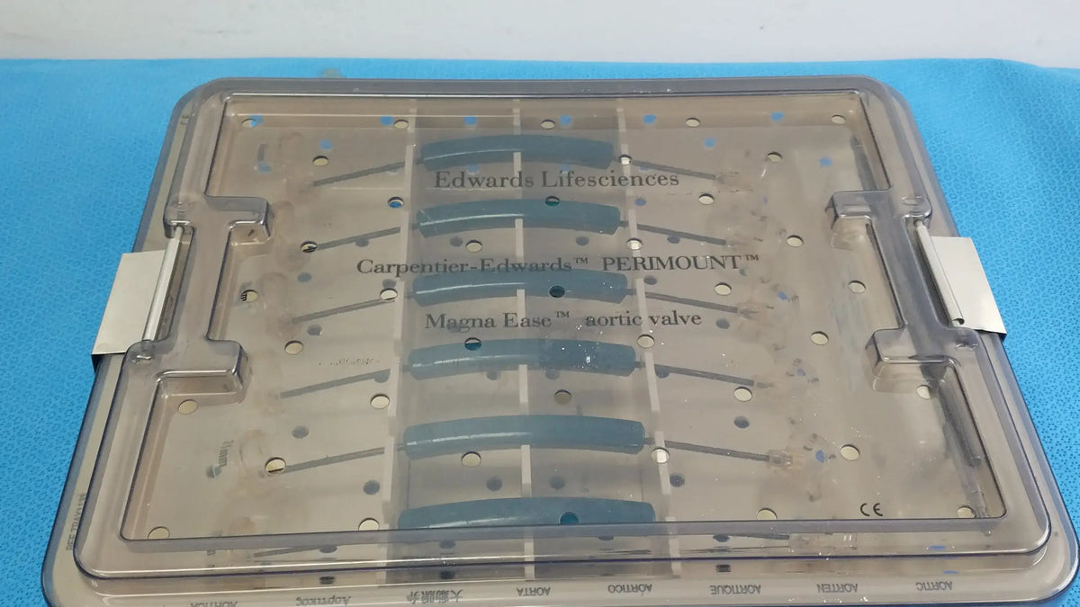Clear plastic surgical tray with labeled compartments holding blue valve components from edwards life science 1111 aortic valve sizer set for buy used medical equipment