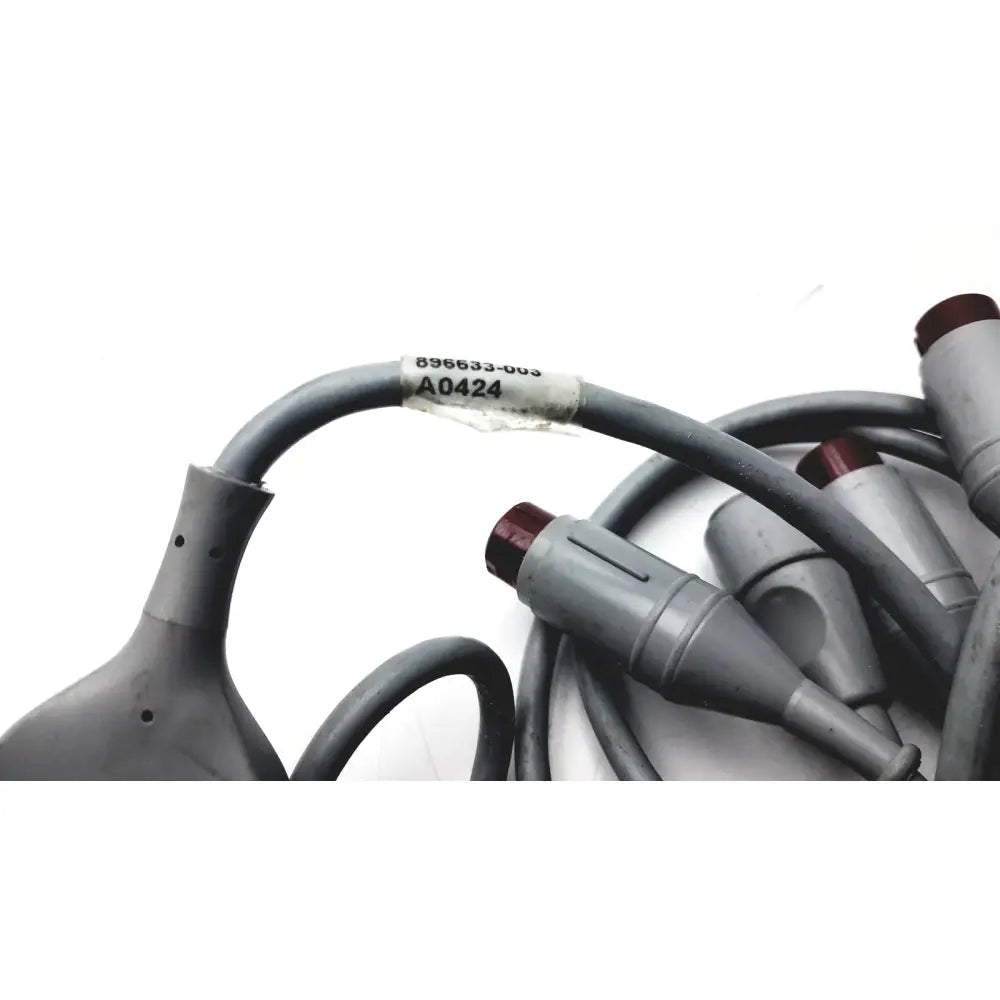 Gray coiled edwards lifesciences a0424 truwave reusable cable with gray connectors and maroon caps for medical use