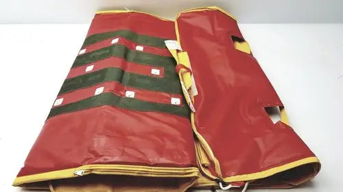 Evacusled emergency patient evacuation sled featuring a red and green striped inflatable mattress with yellow trim
