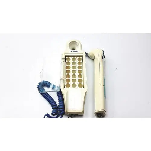 Cream-colored cactus brand hair straightener and handheld device with blue coiled cord for firsttemp genius calibrator use