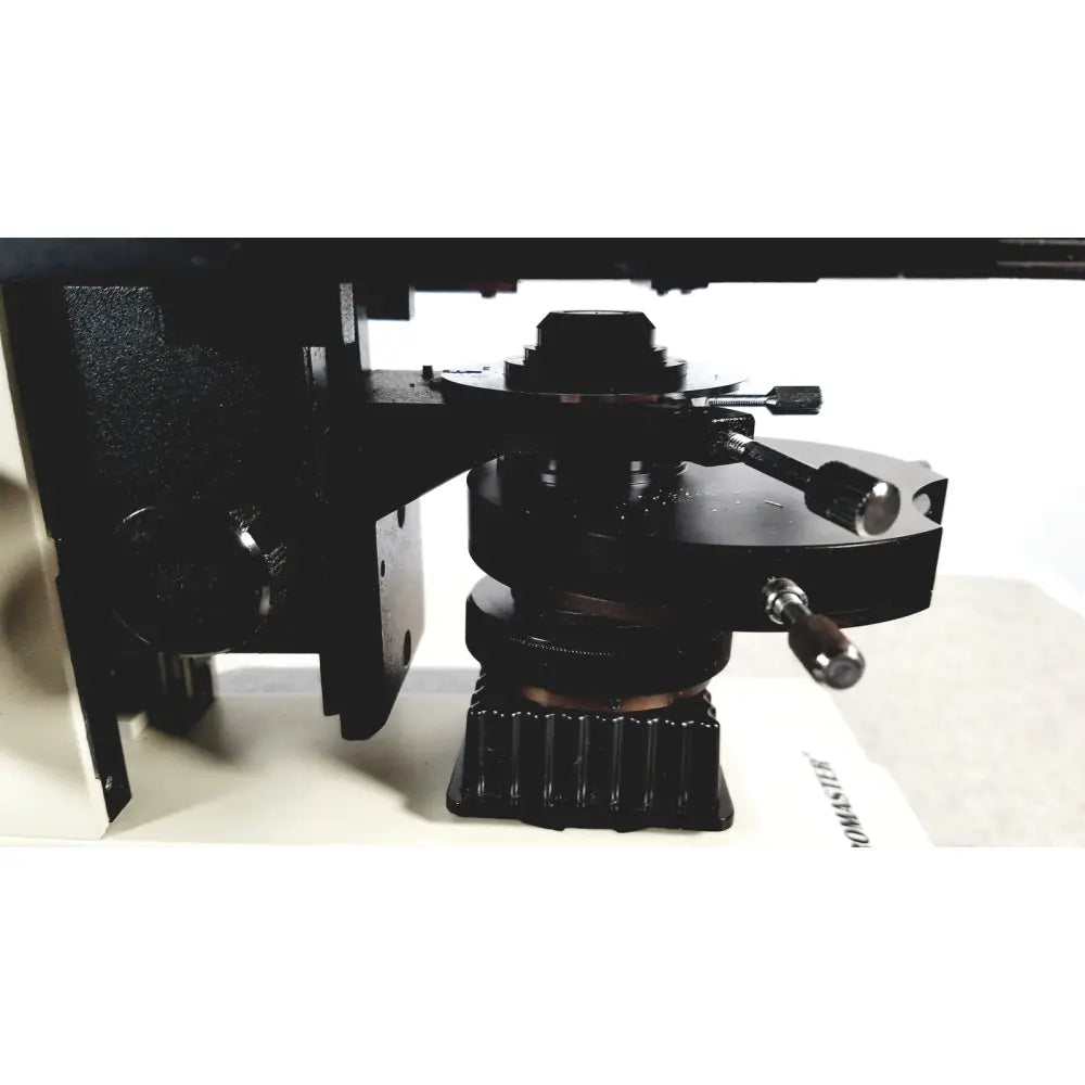 Black metal microscope stage with adjustable knobs and textured base for fisher scientific micromaster 12-561-3faz