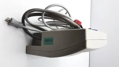 Gray and white wall-mounted Gaymar SPR Plus III power strip with coiled gray cords for medical use