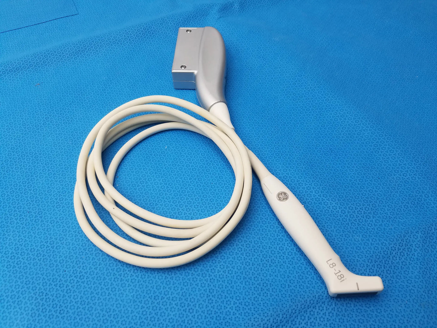 White ge healthcare l8-18i-rs ultrasound transducer probe with coiled cable and silver connector compatible ge healthcare