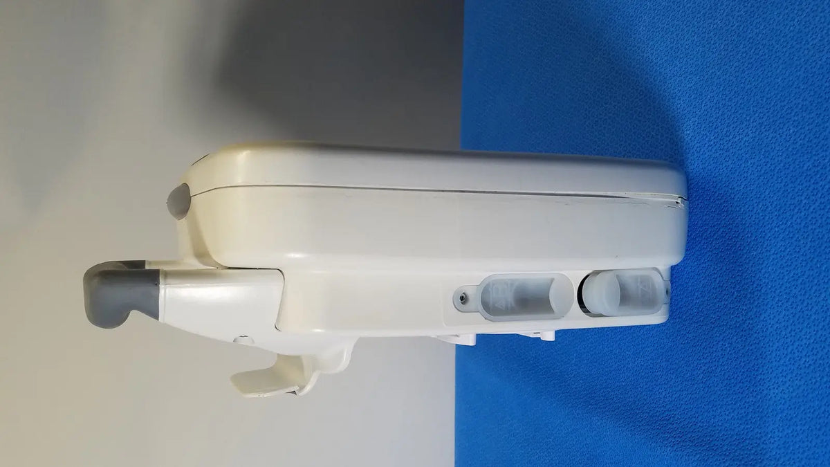 White plastic wall-mounted GE Healthcare Transport Pro patient monitor with gray accents and two circular transparent windows