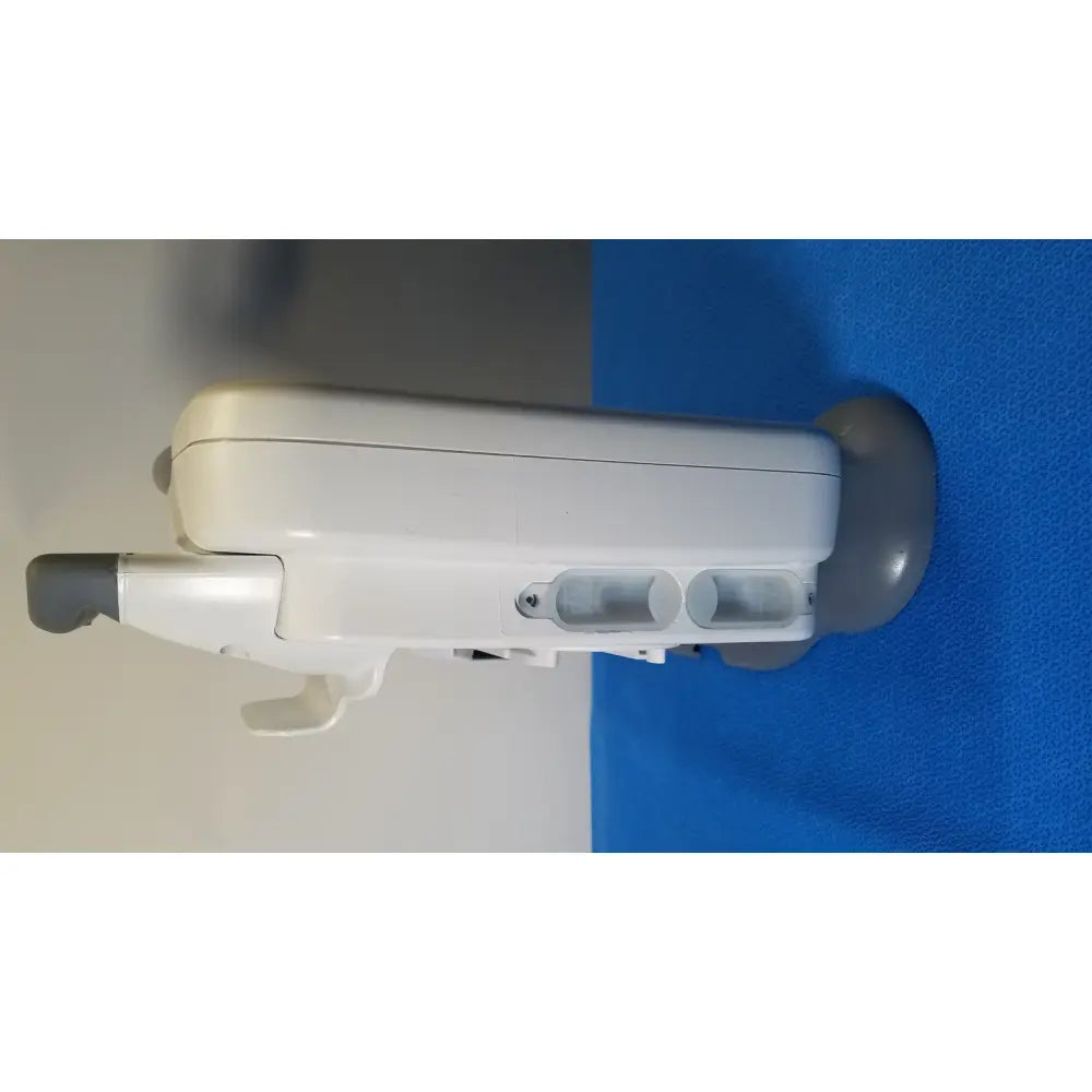 White plastic healthcare transport pro patient monitor with gray accents and two circular side openings