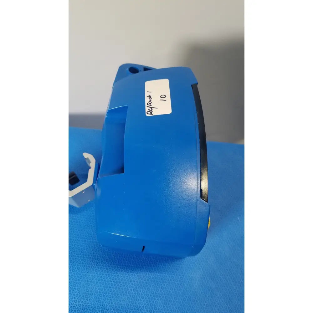 Blue plastic component with white refrack 10 label on the side of ge healthcare v180-jbac-axaa-xx vital signs monitor