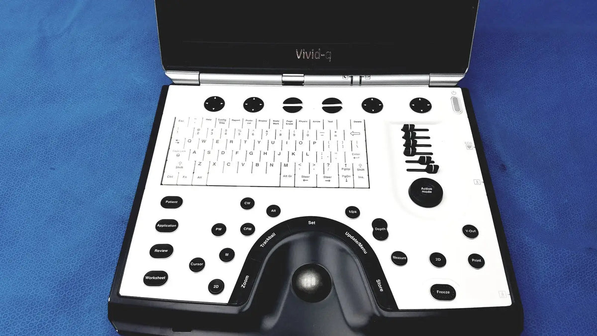 Black and white GE vivid portable ultrasound machine with keyboard and control buttons displaying vivid-i3 brand name