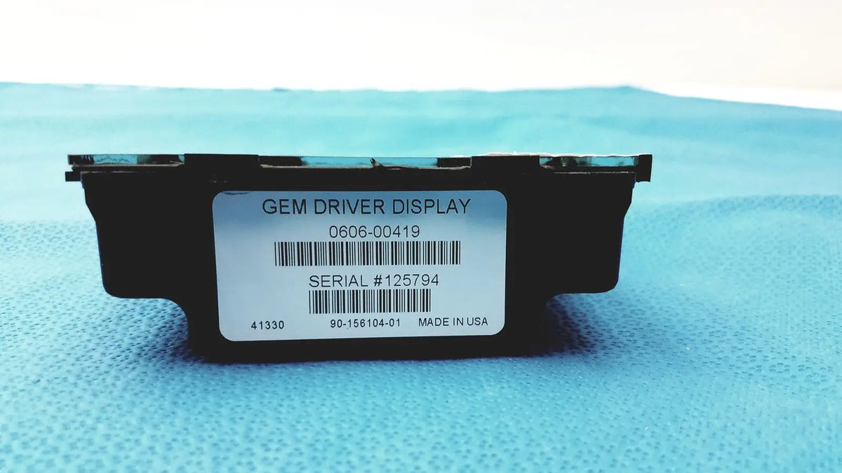 Black rectangular gem driver display with white label showing barcode and serial number made in the USA reuse medical device