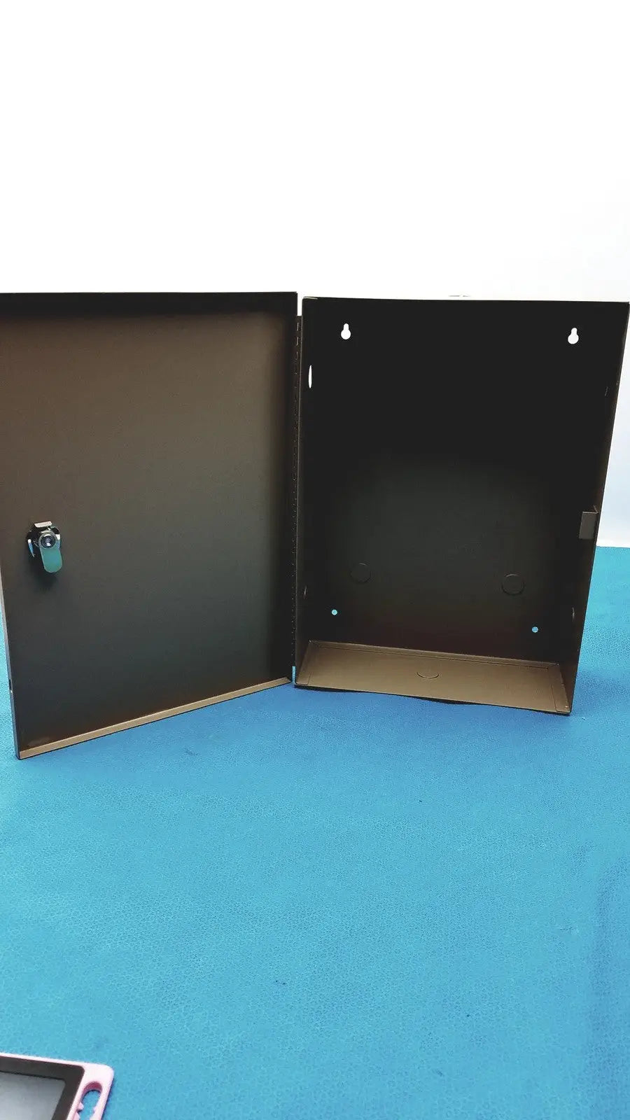 Black general purpose medium steel nema 1 enclosure with hinged door and small latch for industrial use