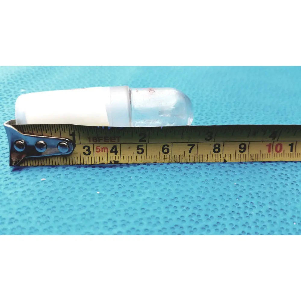A translucent plastic ground glass lab stopper with a white cap measuring 3.5 inches for glass flask stoppers