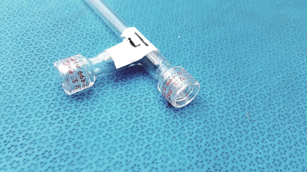 Clear plastic y-shaped medical tubing with labeled ports and white adhesive band for glass schlenk storage tube high vacuum ptfe valve