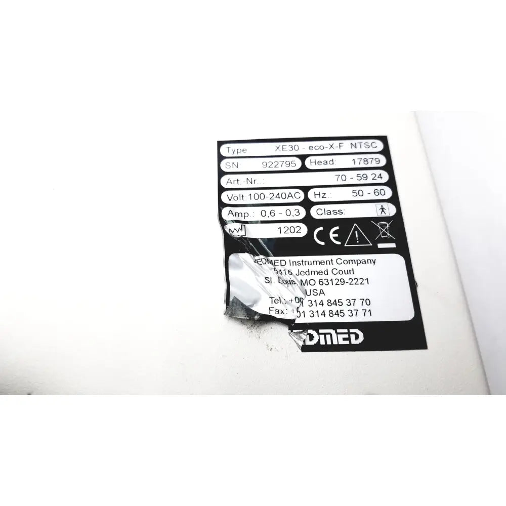 Black and white label on the back side of globalmed innovative telemedicine xe30-eco-x-f ntsc light source device