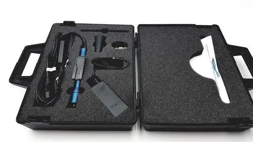 Black foam-lined case with globalmedia totalexam handheld blue and silver device for handheld medical examination