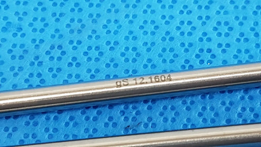 A sleek metallic german stainless steel surgical scalpel handle with engraved gs 12.1604 for precision use