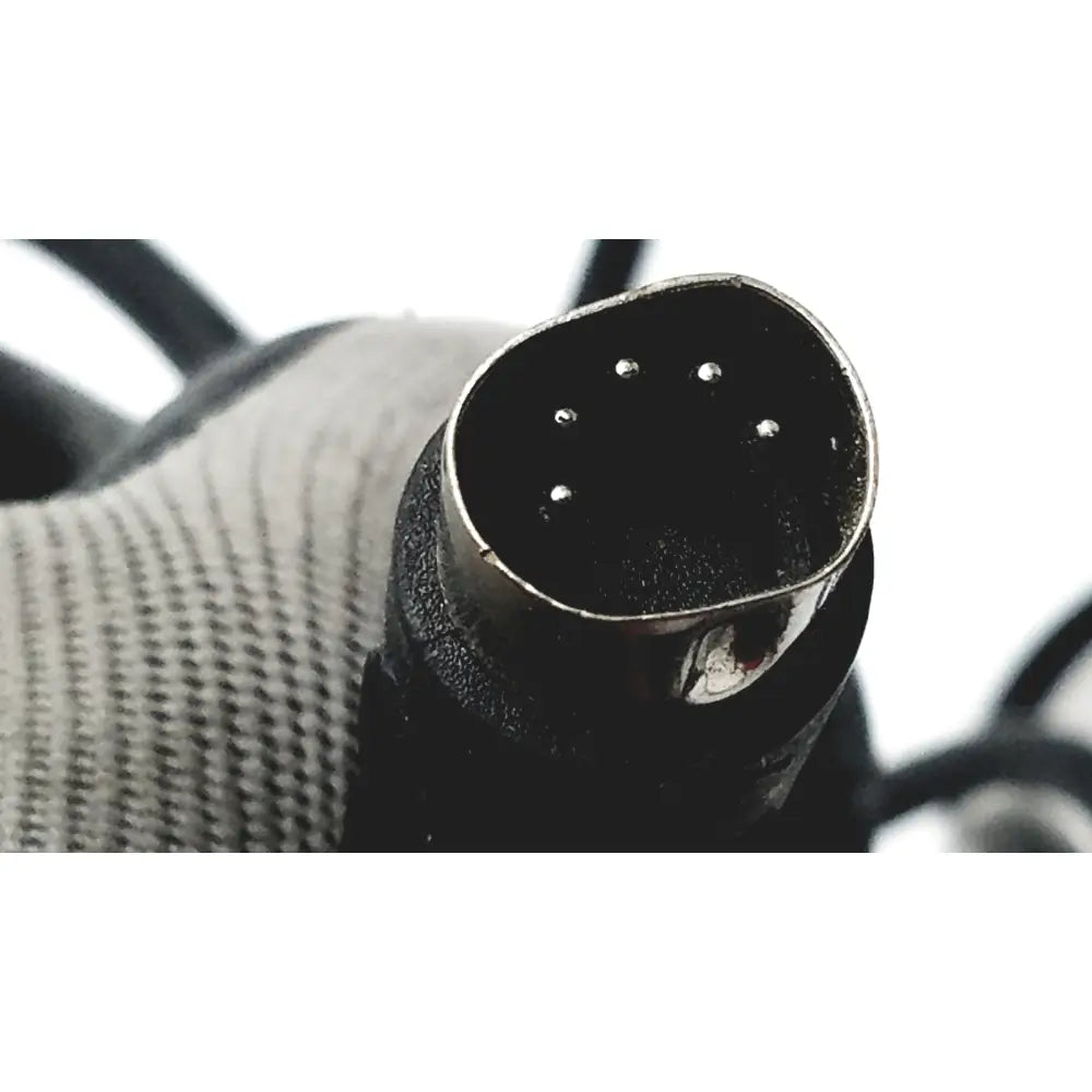 Black xlr audio connector with metallic rim and five silver pins on the back of heavy duty foot enclosure with clipper linemaster control
