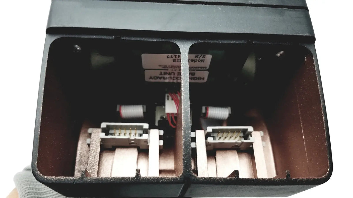 Black plastic housing with two white and red electrical connectors on the back of heise hand held calibrator 6d49 e171189