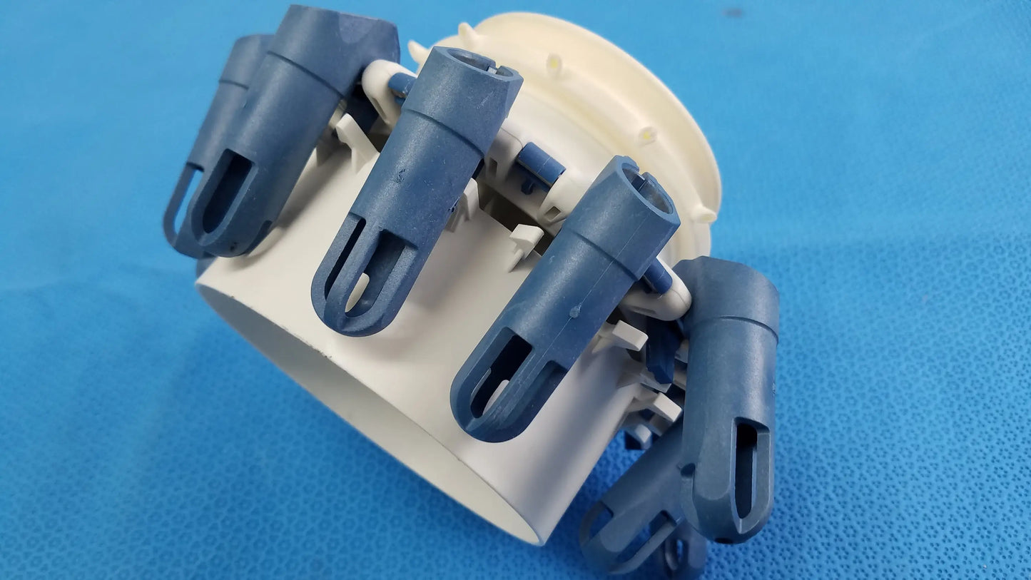 Blue plastic pipe clamp with beige base compatible with Helmer centrifuge rotor and tube inserts for 3500 RPM use