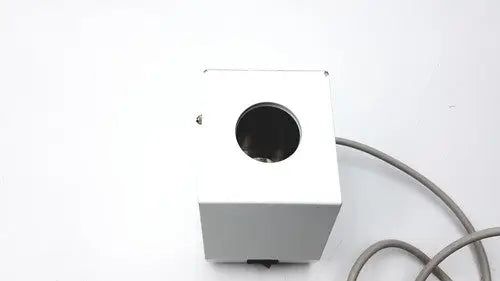 White rectangular ideal products ultrasonic gel heater gw108 with circular opening and gray cable on side
